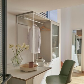 A modern room with a desk, a chair, a wardrobe, and a mirror. - Express by M Village Nguyen Du, a brand of Modern Village Lifestyle (Ho Chi Minh City)