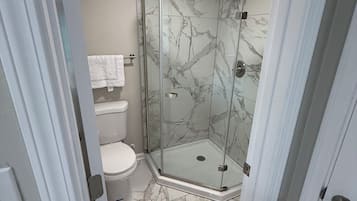 Shower, towels, soap, toilet paper