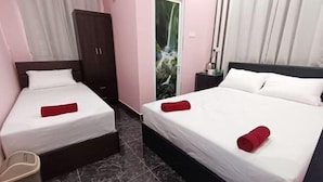 A hotel room with two beds, a wardrobe, a trash bin, and a door with a waterfall mural. - Sunstar Hotel (Batu Maung)