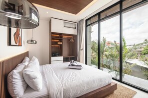 A modern bedroom with a large bed, built-in wardrobe, and a view of the city through large windows.