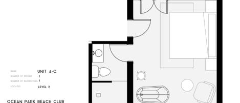 A floor plan with a bathroom, a kitchen, a dining area, and a living room.
