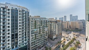 A high-rise building with multiple floors, large windows, and a modern architectural design.