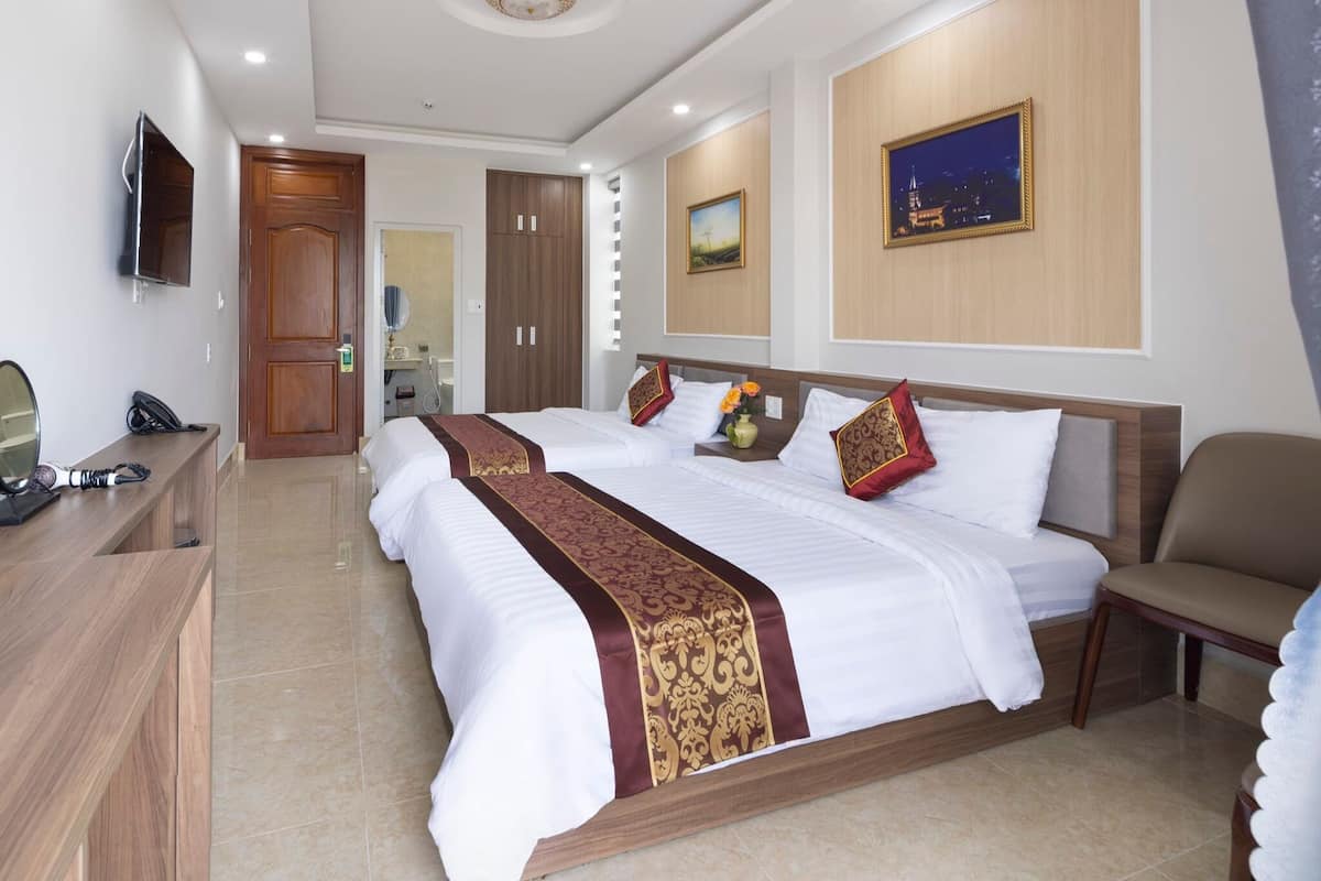 Deluxe Quadruple Room, City View | Desk, laptop workspace, free WiFi