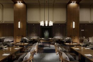 A hotel lobby with a central seating area, multiple tables, and a large chandelier. - Takanawa Hanakohro, a Member of Small Luxury Hotels of the World (Tokyo)