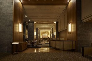 A spacious lobby with a reception desk, seating area, and a view of the hotel entrance. - Takanawa Hanakohro, a Member of Small Luxury Hotels of the World (Tokyo)