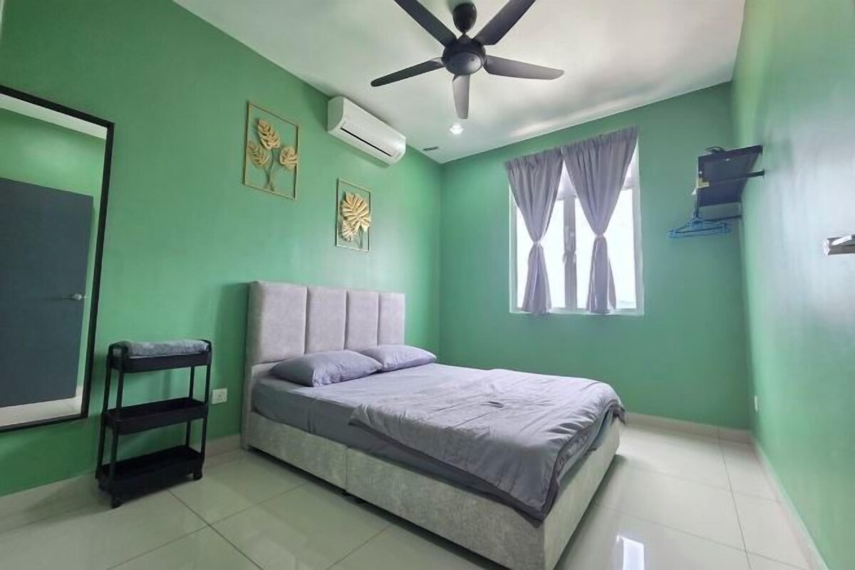 A room with a bed, a ceiling fan, an air conditioner, a window with curtains, and a wall-mounted shelf.