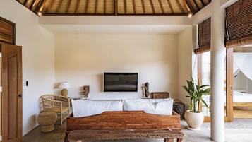 Deluxe Villa, Patio, Pool View | Living area | 42-inch flat-screen TV with cable channels