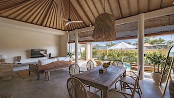 Deluxe Villa, Patio, Pool View | Dining room