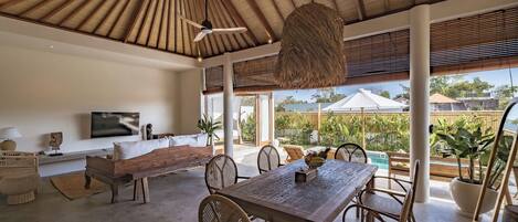 Deluxe Villa, Patio, Pool View | Dining room