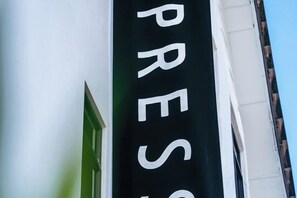A building with a sign that reads 'PRESS'. - Hako Xpress Tampoi (Johor Bahru)