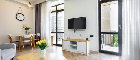 Classic Apartment, Balcony | Living area | 50-inch flat-screen TV with cable channels