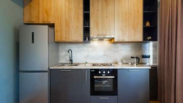 Basic Apartment, Balcony, City View | Private kitchen | Full-size fridge, oven, stovetop, electric kettle