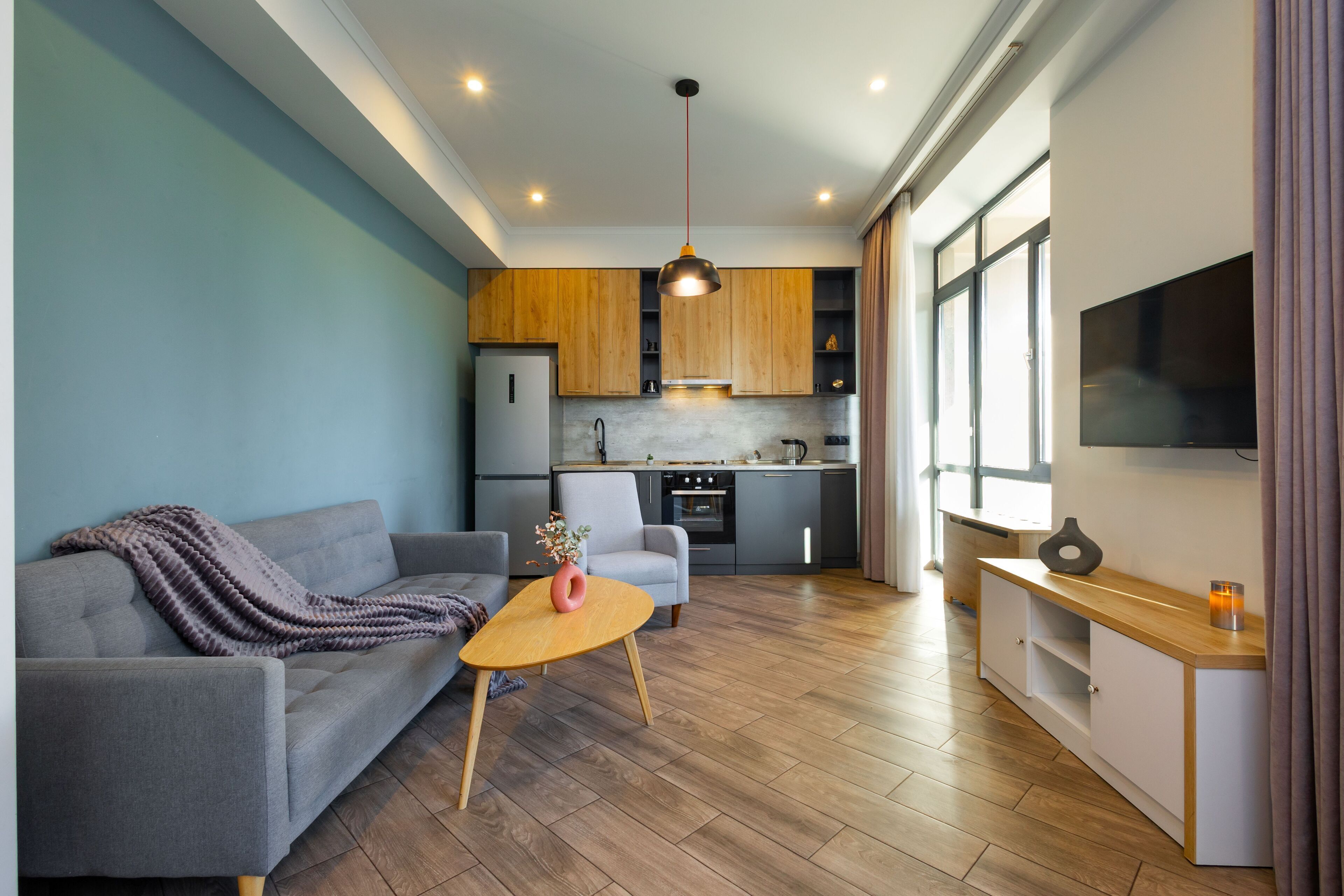 Basic Apartment, Balcony, City View | Living area | 50-inch flat-screen TV with cable channels