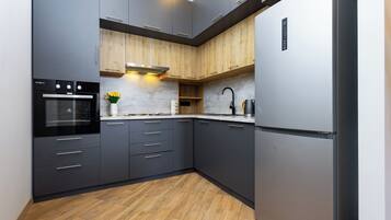 Comfort Apartment, Balcony | Private kitchen | Full-size fridge, oven, stovetop