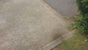 A residential street with parked cars and houses. - Glenville Apartment (Greater London)