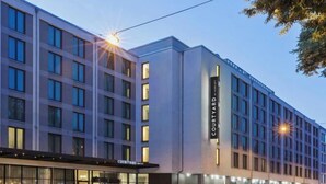 A multi-story hotel with a modern facade, large windows, and a prominent 'Courtyard' sign. - Courtyard by Marriott Munich City East (Munich)