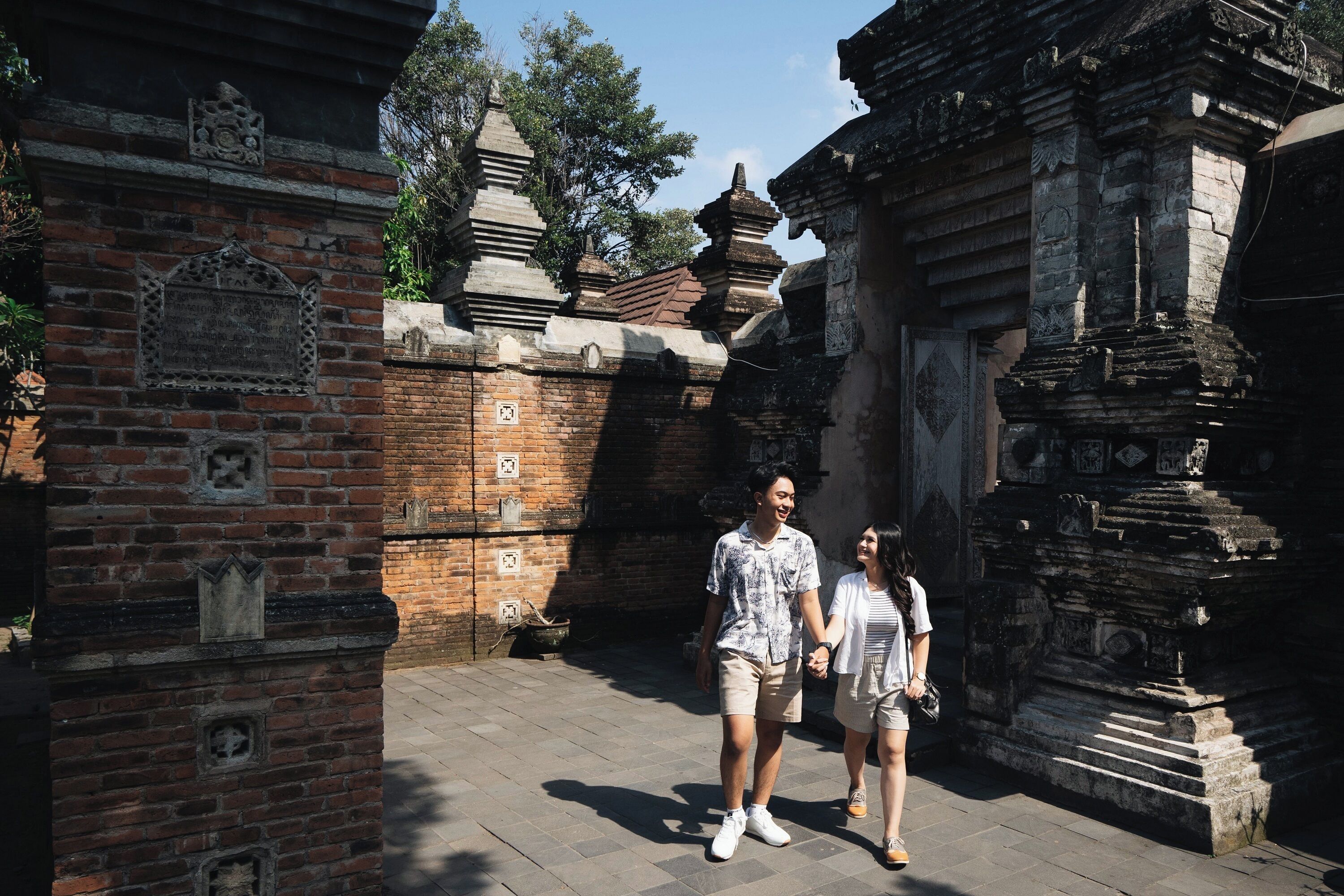 A historical site with ancient brick structures and stone carvings.