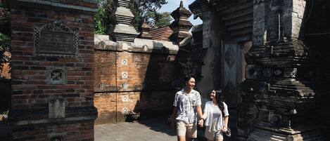 A historical site with ancient brick structures and stone carvings.