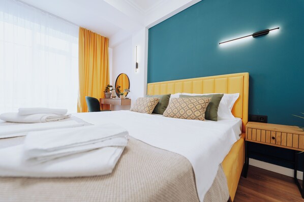 1 bedroom, desk, iron/ironing board, travel crib