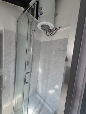 Shower, towels, soap, toilet paper