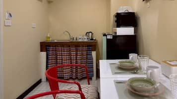 Family Quadruple Room, Balcony, City View | In-room dining