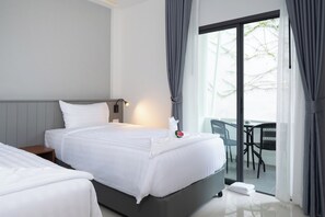 Habitación Deluxe con 2 camas individuales, balcón | Wifi gratis