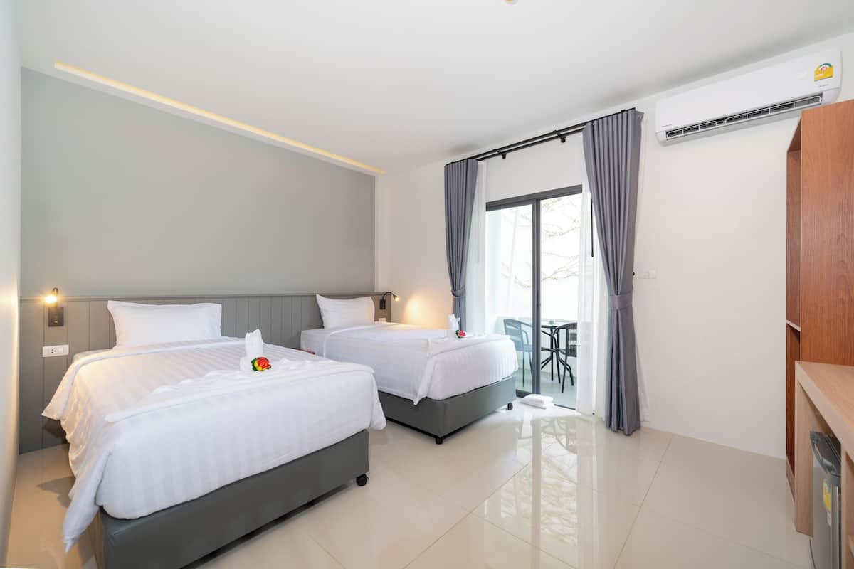 Habitación Deluxe con 2 camas individuales, balcón | Wifi gratis