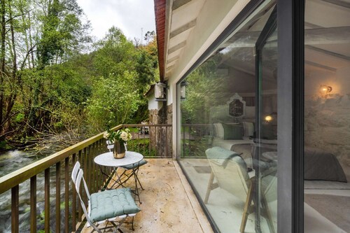 Riverfront Retreat with Exclusive Waterfall Views