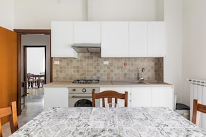 Apartment, 1 Bedroom, Balcony | Private kitchen | Fridge, oven, stovetop, electric kettle - Via Franco Bolognese by Wonderful Italy (Bologna)