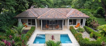 Beautiful Home in a Gated Neighborhood, Walking Distance to the Beach with Garden Views and a Pool