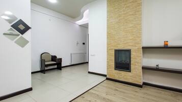 Comfort Apartment, 2 Bedrooms, Balcony, City View | Living area | 50-inch flat-screen TV with cable channels