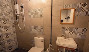 Shower, towels, soap, toilet paper