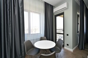 Classic Apartment, Balcony, City View | Living area | 50-inch flat-screen TV with cable channels - Apartment by Luxe Group AM2614 (Yerevan)