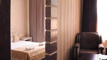 Deluxe Double Room, Courtyard View | Desk, laptop workspace, soundproofing, iron/ironing board