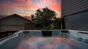 A hot tub with a view of a house and a tree. - Grand Ogden Lodge, Hot Tub, Close to Ski Resorts – 6 BR | 5 Baths | Hot Tub (North Ogden)