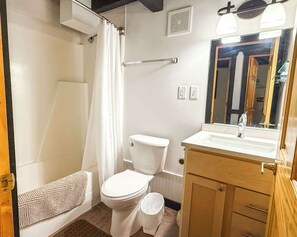 Shower, hair dryer, towels, shampoo