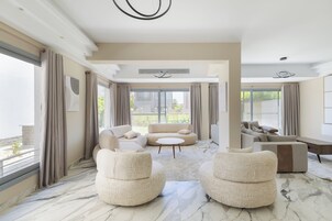 Deluxe Villa, Garden View | Living area | 65-inch Smart TV with digital channels