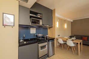 Premium Studio, City View | Private kitchen | Mini-fridge, microwave, stovetop, dishwasher