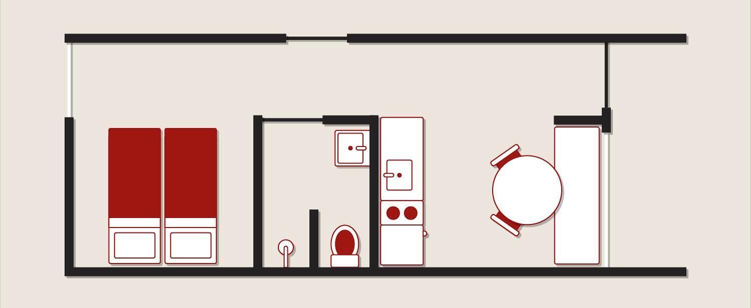 A floor plan of a hotel room with a bed, a desk, a chair, a wardrobe, a small bathroom, and a toilet.