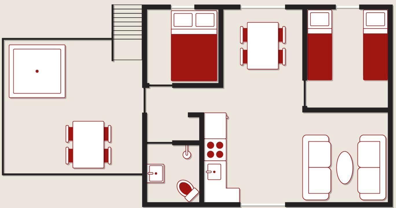 Un plan d’étage d’une chambre d’hôtel comprenant un lit, un bureau, une chaise, un petit coin cuisine et une salle de bain.