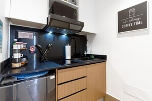 Fridge, microwave, stovetop, coffee/tea maker