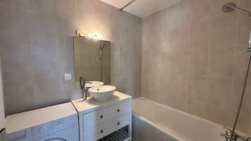 Shower, towels, soap, toilet paper