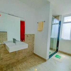 Shower, towels, soap, toilet paper