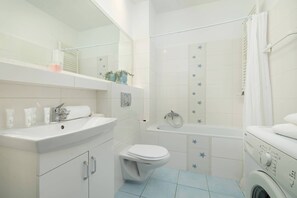 Shower, hair dryer, towels, shampoo