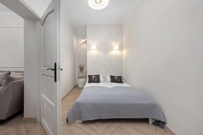 1 bedroom, desk, iron/ironing board, travel crib