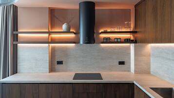 Superior Apartment, Garden View | Private kitchen | Stovetop, dishwasher, cookware/dishes/utensils, dining tables