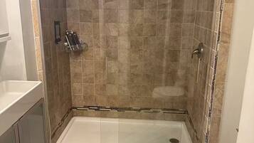 Shower, towels, soap, toilet paper