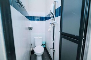 A small bathroom with a toilet, a bidet, and a shower. - Swing & Pillows at Penang Road, Georgetown (Northeast Penang Island)