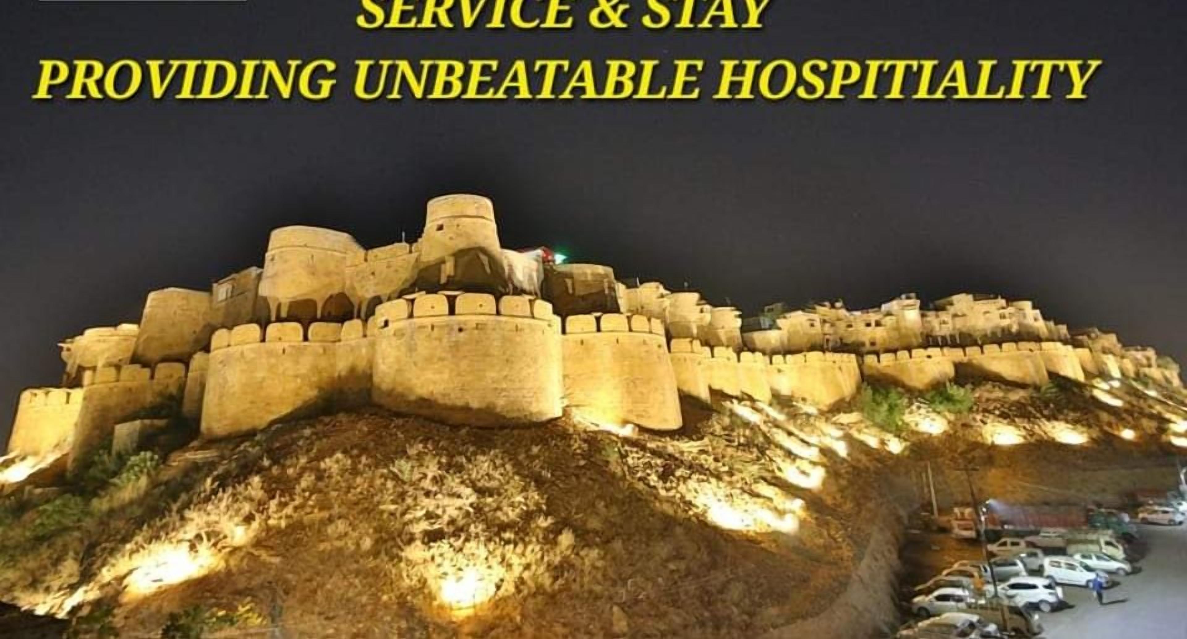 A fortified structure with a hotel sign, indicating a location with historical significance and modern amenities.
