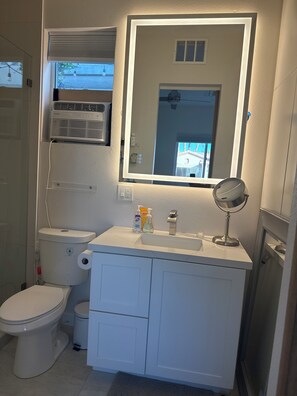 Shower, hair dryer, towels, soap